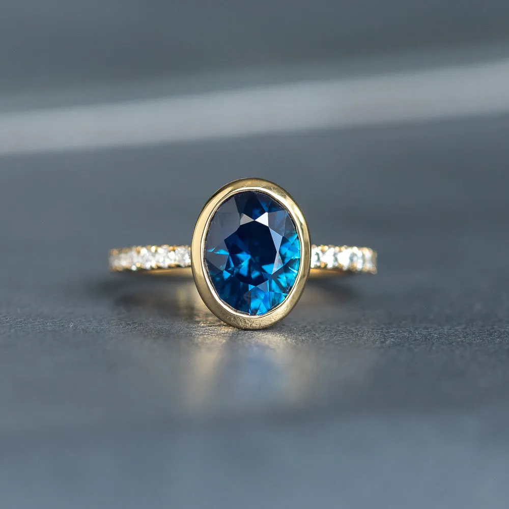 2.49ct Oval Blue Nigerian Sapphire Low Profile Bezel with French Set Diamonds 18k Yellow