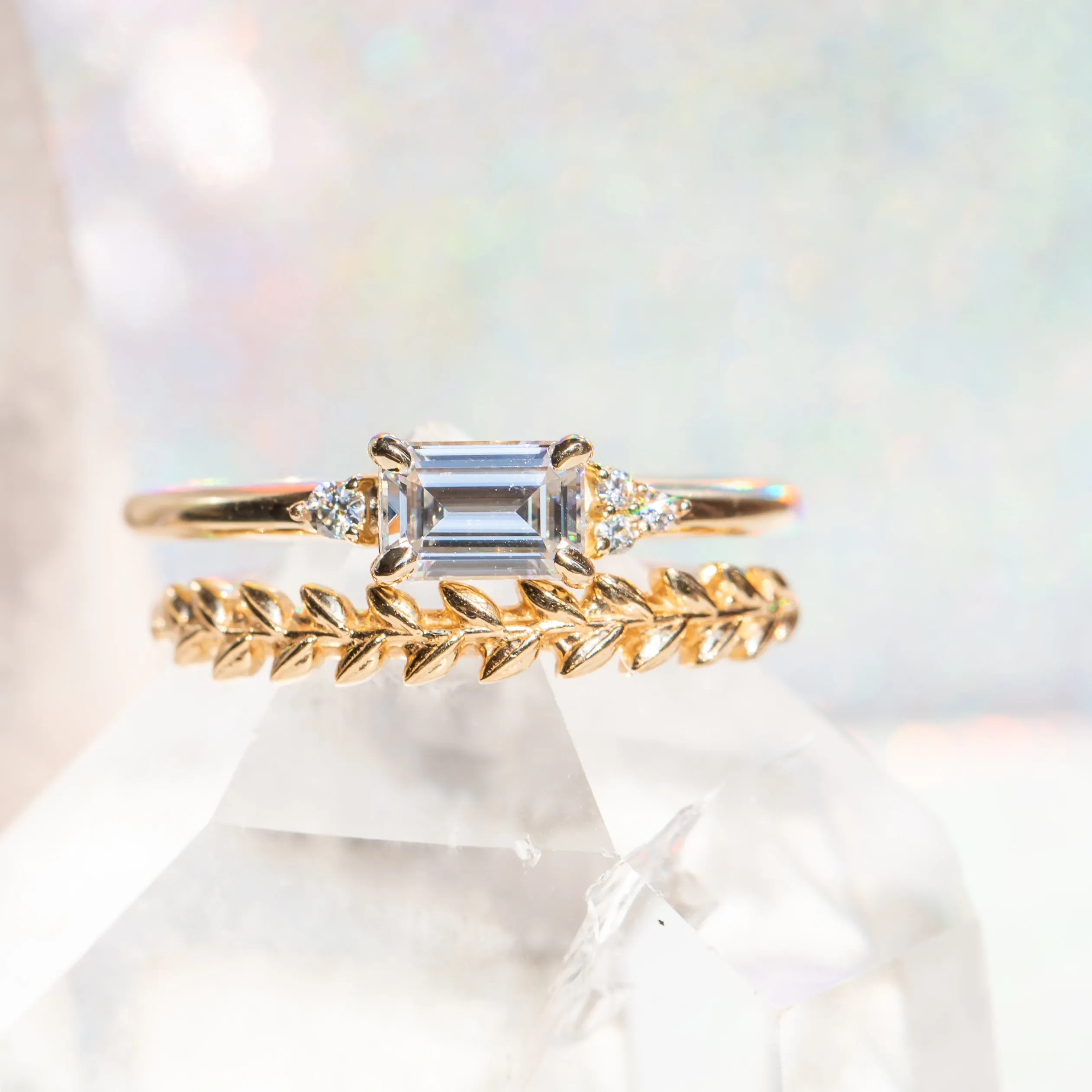 East-West Emerald cut Moissanite Asymmetrical Ring in 14k Yellow Gold